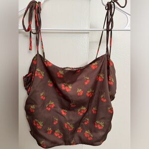 Brown tank with cherries